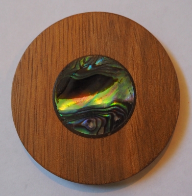 The robinia disc 
with the paua centre.