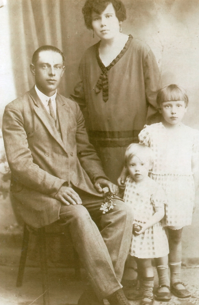 A studio    
photograph of Henryk, sitting, and Waleria and their daughters, standing