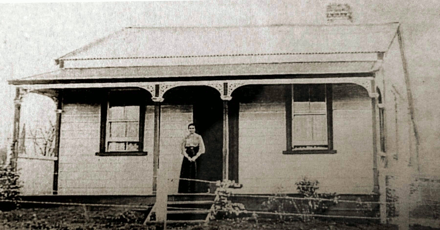 House on 
Humphries Street with Anna standing on the porch