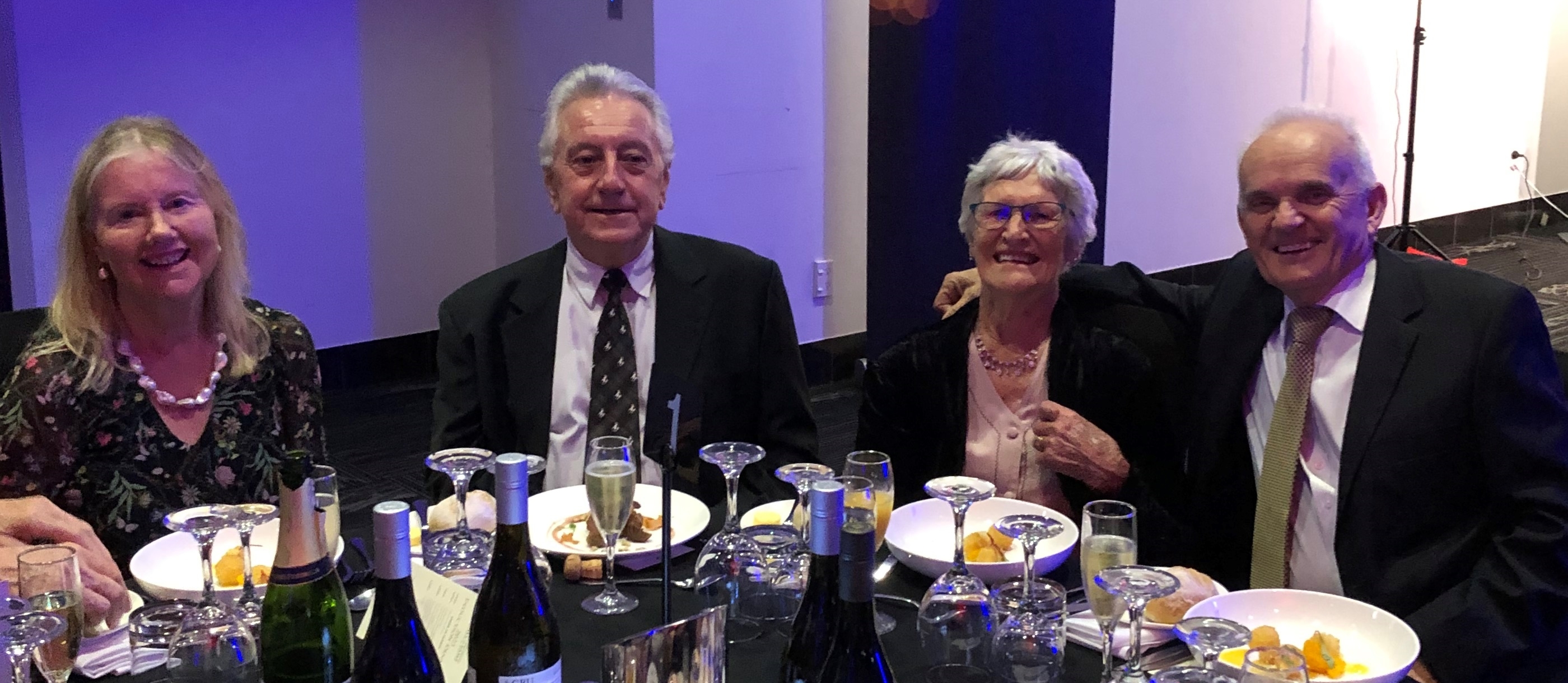 Faye, at the 
   function, sitting at the table between with Bob Brycki and Brian de Lore.