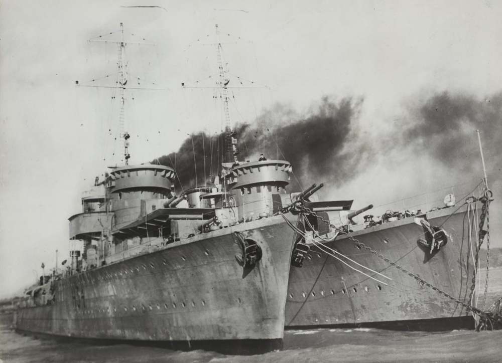 A black and white shot of 
the two ships anchored side-by-side