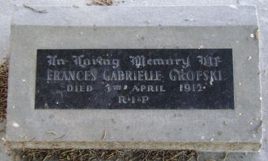Frances Gabrielle Grofski's headstone - a black plaque set in a low cement plinth