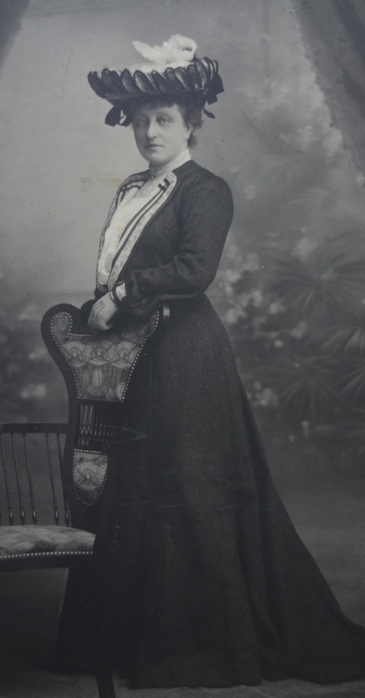 A black and white 
studio pic of an elegant woman