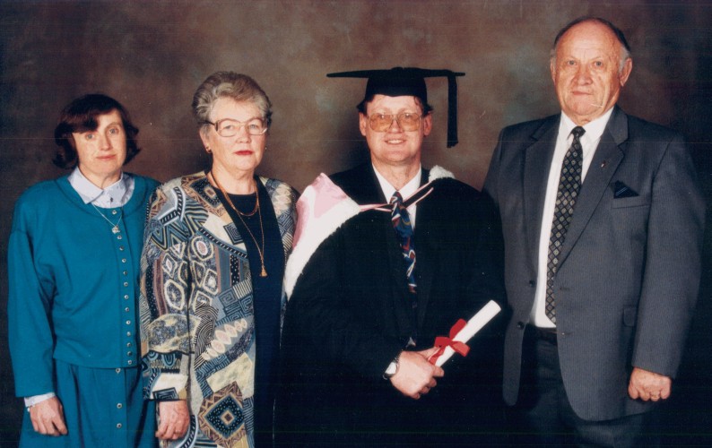 Studio 
photograph of Michael's graduation with Jan, Stella and Rozalia 1996.