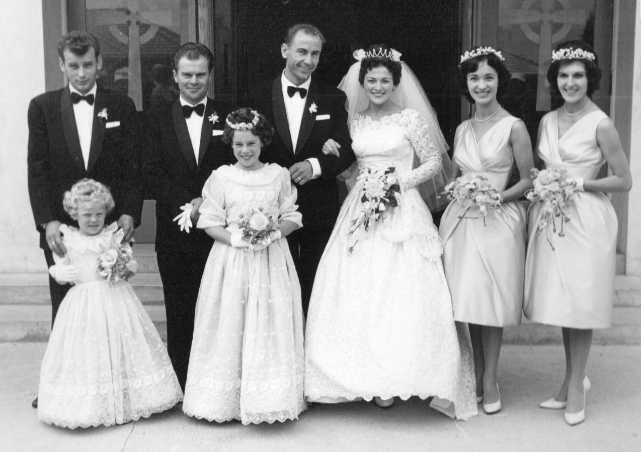 Marysia Dac 
and Franciszek Jaśkiewicz with their entourage outside the church on their wedding day