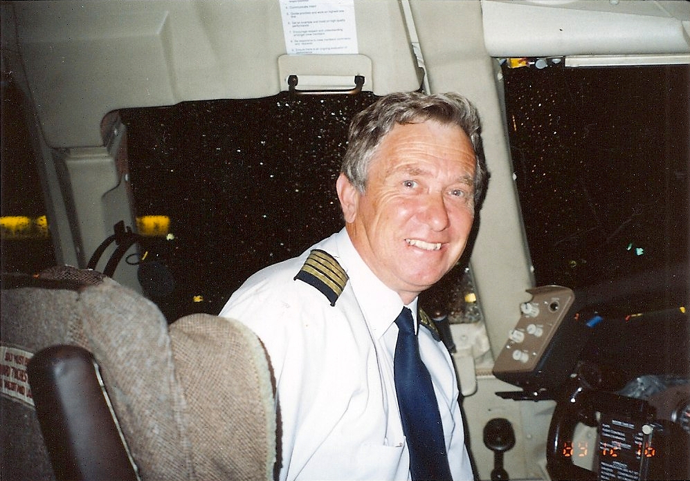 Kazik Zając 
turning to look at the camera while sitting at the cockpit