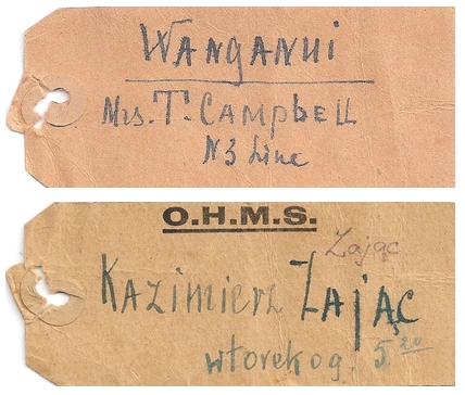 two sides of an 
old-fashioned railway tag, on one side written WANGANUI Mrs T Campbell, N 3 Line and the other, printed with OHMS and 
Kazimierz Zając, wtorek o g 5.20, or Tuesday at 5.20