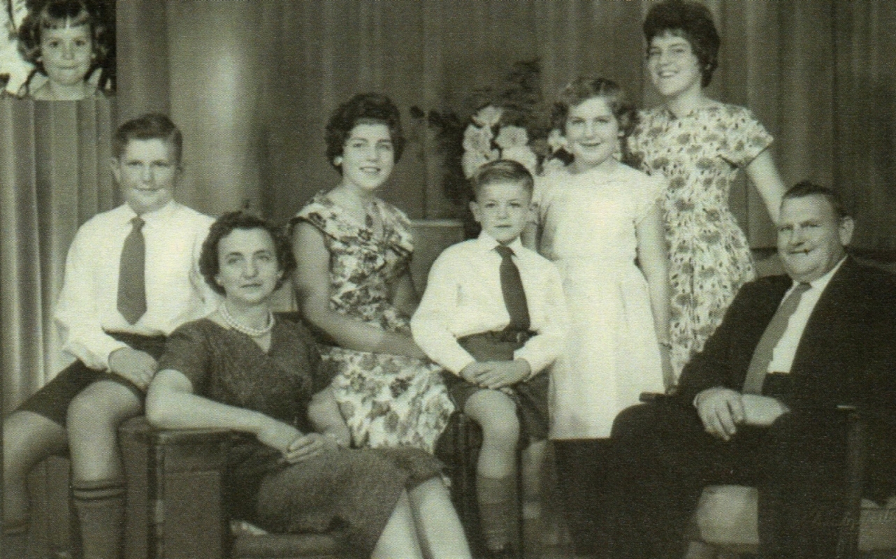 A blurry studio 
photo of Clement and Anne Kuklinski and their six children.