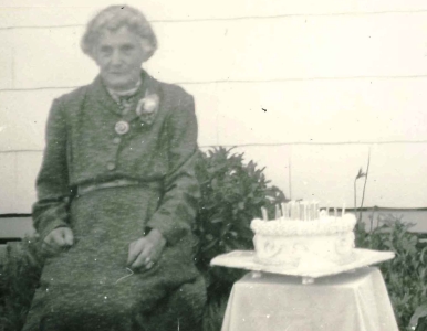 Mary Ryan, 
with 80th birthday cake.