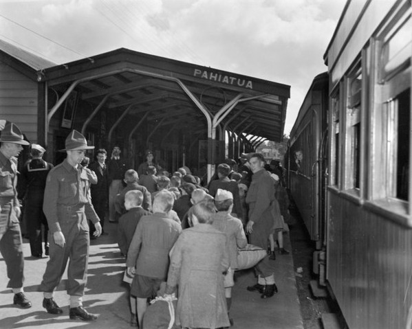 Backs 
of Polish boys with NZ soldiers at Pahiatua Railway Station
