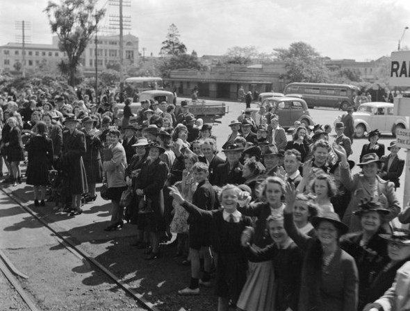 Another 
crowd in Palmerston North waving to the train