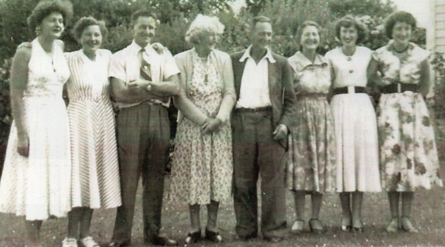 Josie Lewandowski 
Bayly with her husband Howard and their adult son and daughters, sunny day outside.