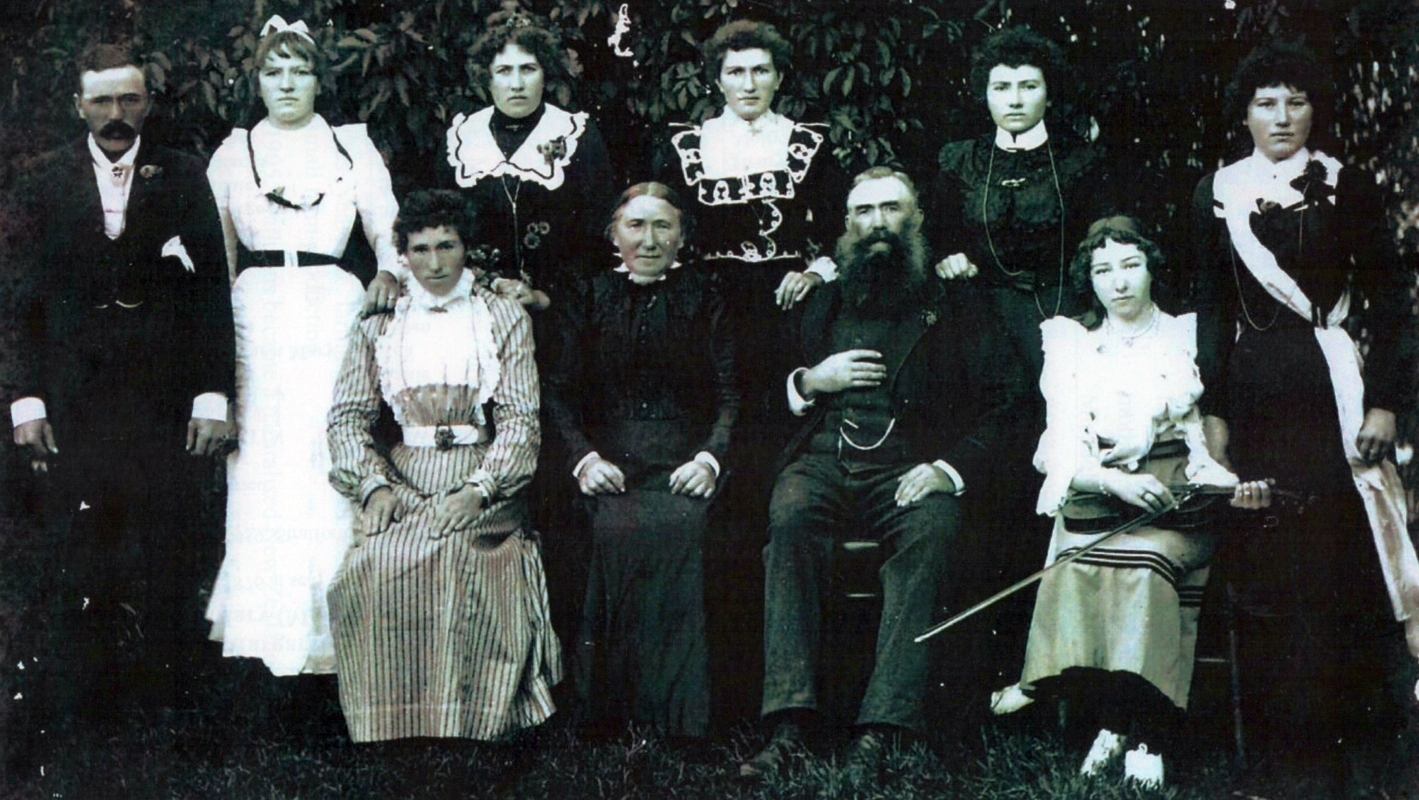 The entire 
Lewandowski family, photograph taken outside.