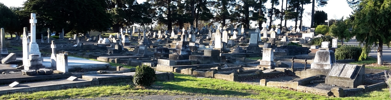 Wide view of 
the Linwood cemetery, showing headstones in the setting sun.