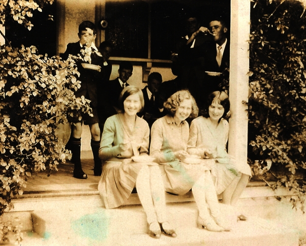 Gertrude, Madeline and Rayena Orlowski sitting on the steps of a friend’s house