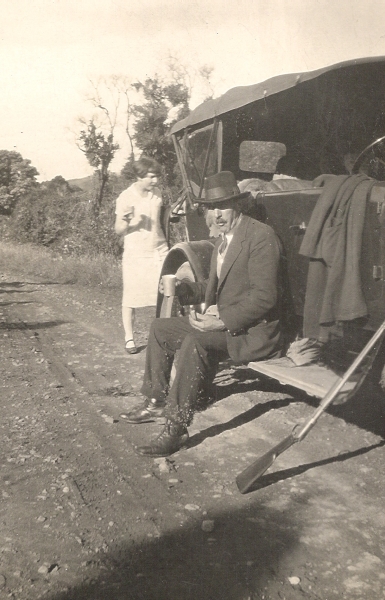 John Andrew 
Orlowski sitting on the running board of his Crossley