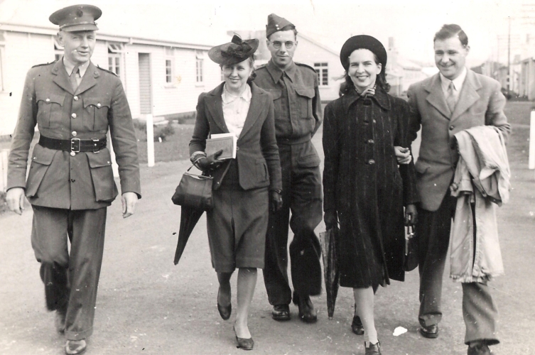 Madeline, centre, with Rayena and her husband in Auckland, and two men in army uniform