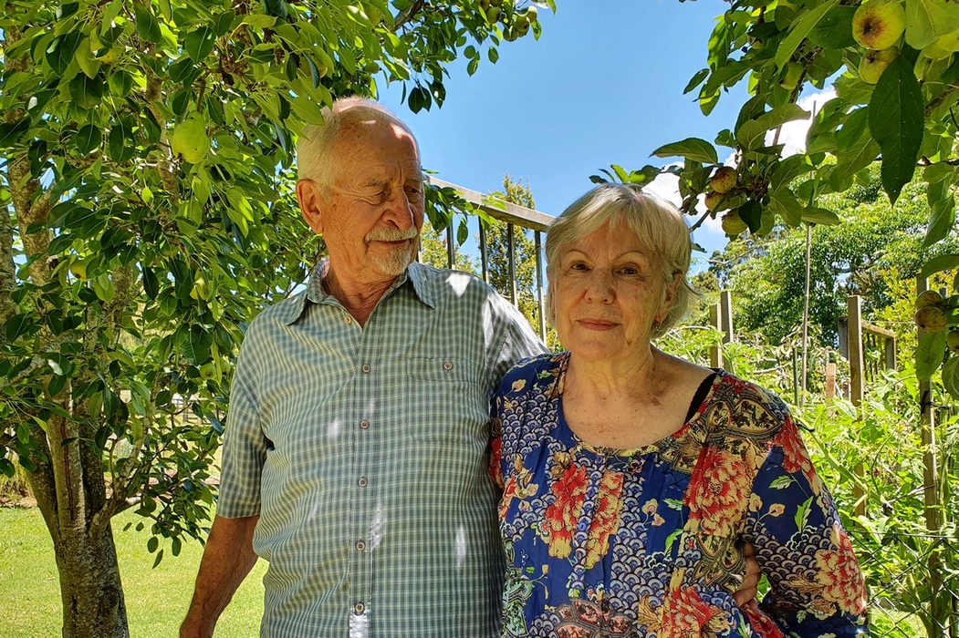 Coloured pic 
taken in the Pąk's back garden under pear and apple trees. Michal is looking at Zenona and Zenona smiling at the camera.