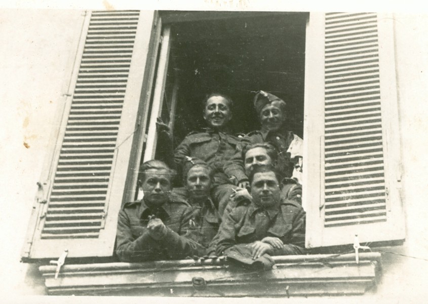 Polish 
soldier students looking out of a window in Ascoli Picento