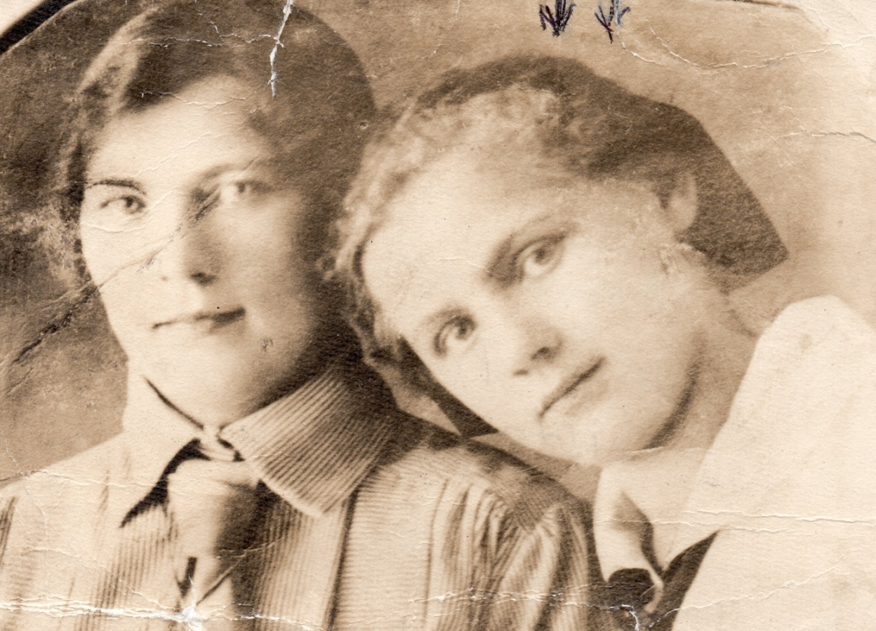 Close-up of Maria Fidelis Pleciak with her head leaning towards another young woman