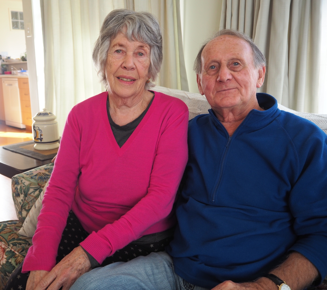 Victor and Elaine  
sitting together on a couch