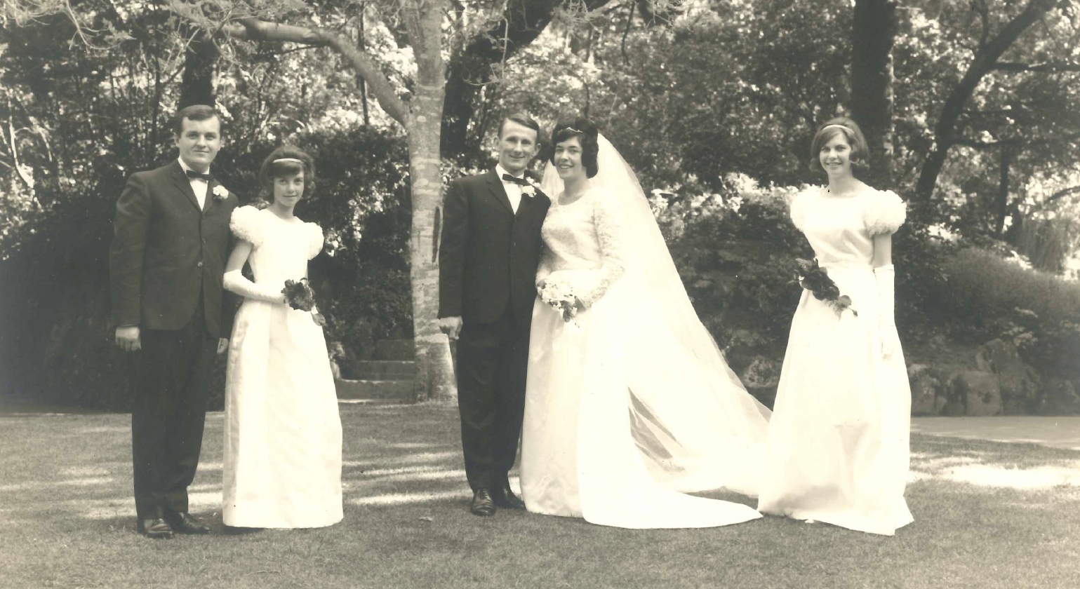 Victor and Elaine on their    
wedding day with their two bridesmaids and best man at the Wellington Botanic Gardens