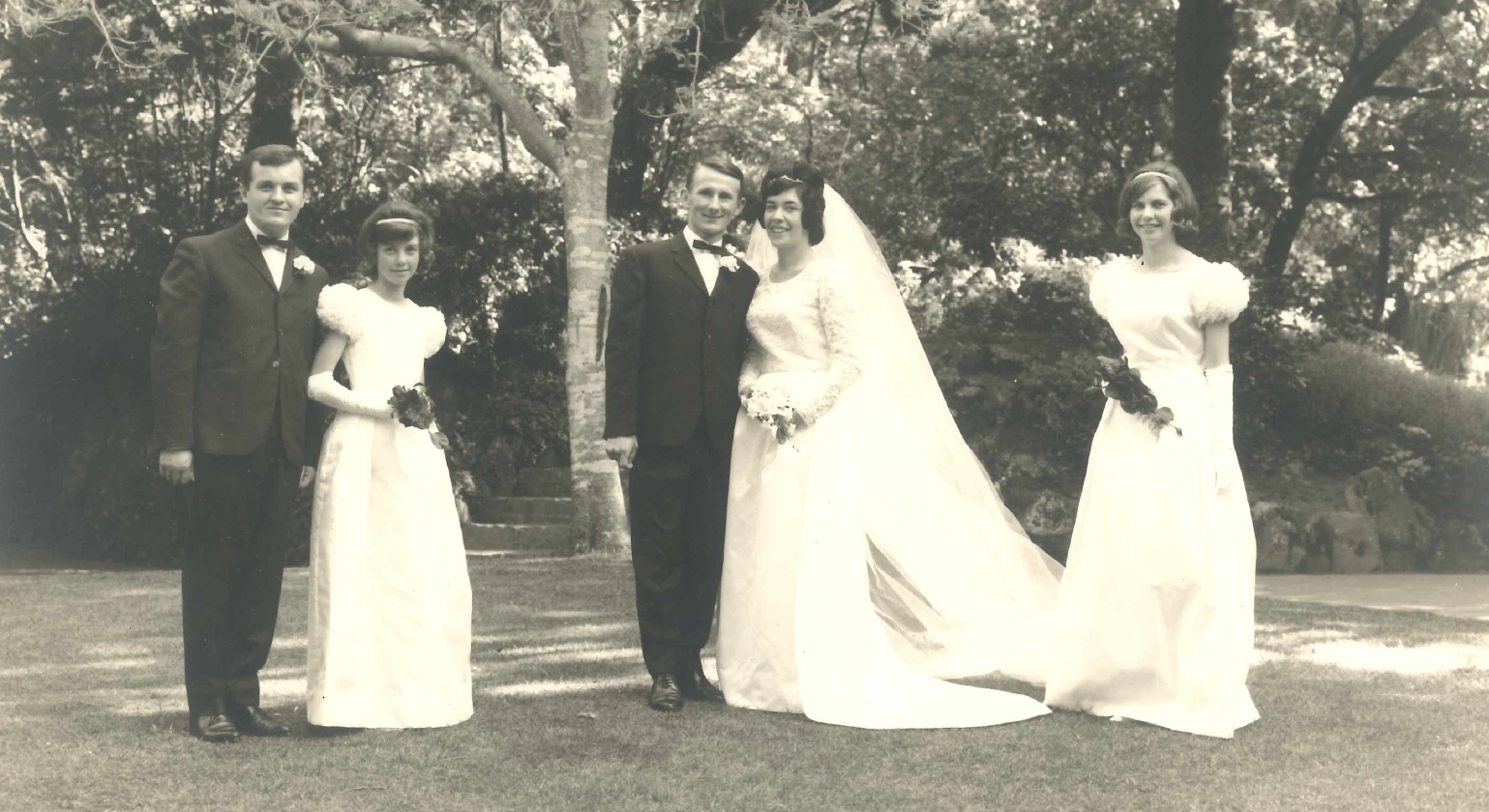 Victor and Elaine on their    
wedding day with their two bridesmaids and best man at the Wellington Botanic Gardens