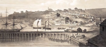 a 
   sepia image of ships on the other side of a wharf, and several house scattered among larger buildings, and a church on the 
   horison on top of the hill