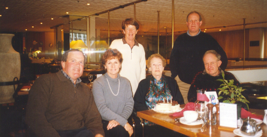 Gladys 
   with her sons and daughters-in-law in a restaurant.