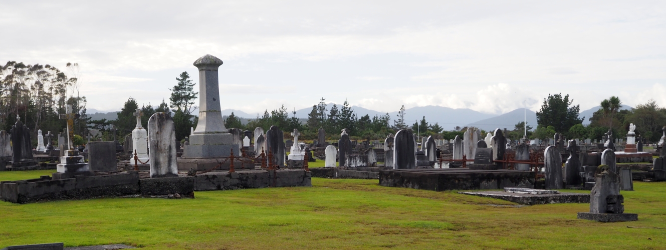 A wide shot of the Hokitika cemetery, showing the hills in the background