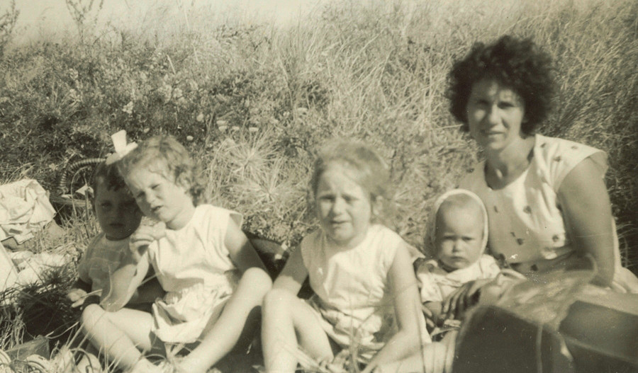 Stasia 
with four children at Wainuiomata beach 1961