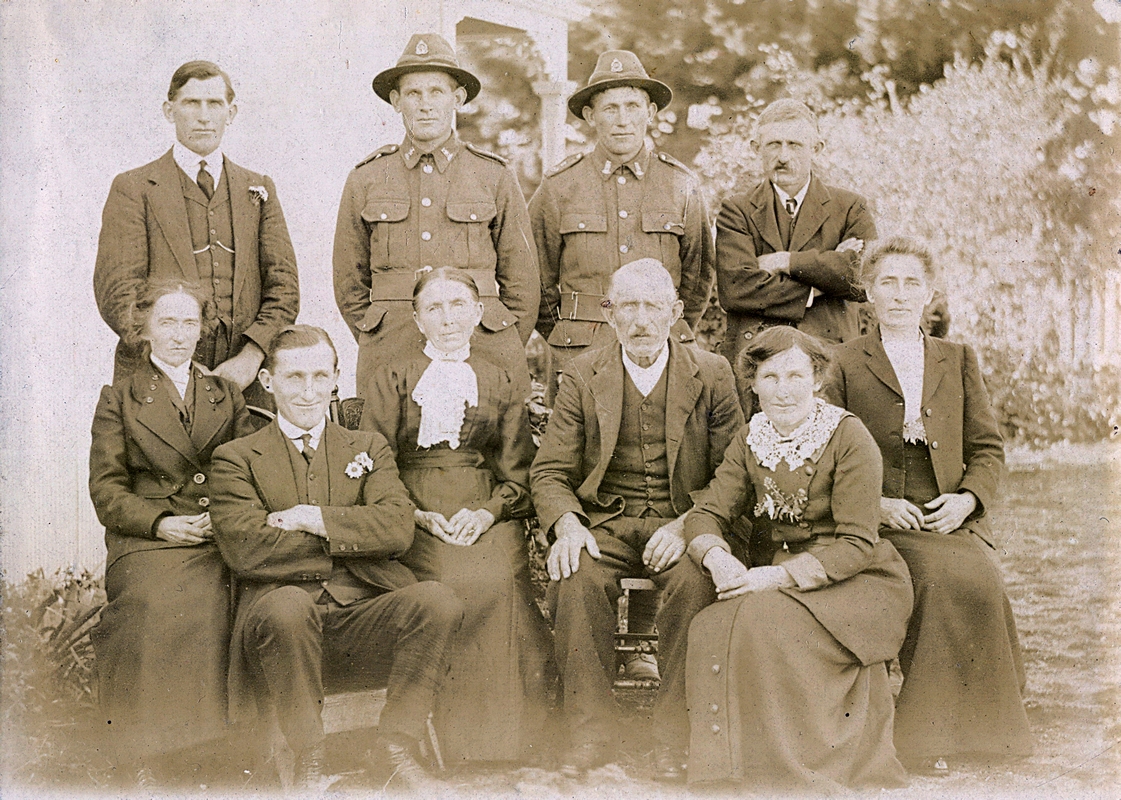 The adult Neustrowski 
family. Photograph taken outside showing the warmth and worry of the family, taken outside.