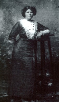 Ellen 
(Nell) Cecelia Voitrekovsky as a young woman in a long dress