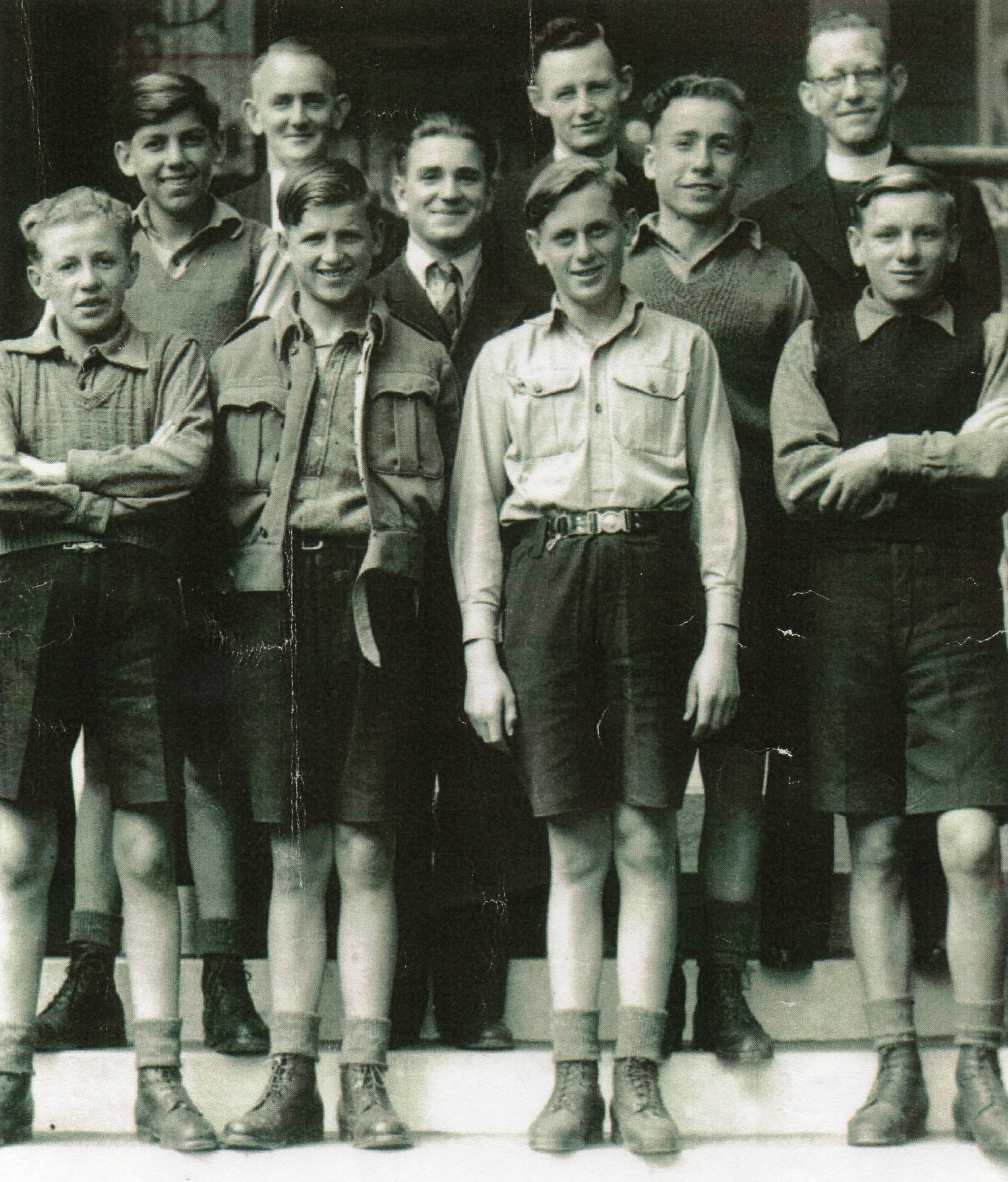 The seven Polish boys 
standing on steps with the three teachers behind. All smiling.