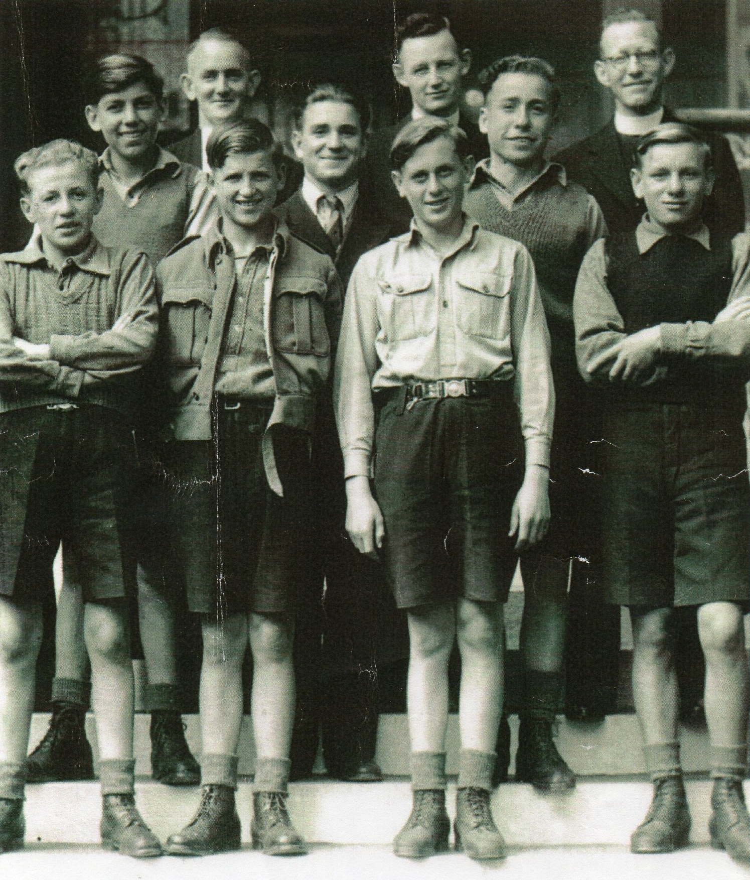 The seven Polish boys 
standing on steps with the three teachers behind. All smiling.