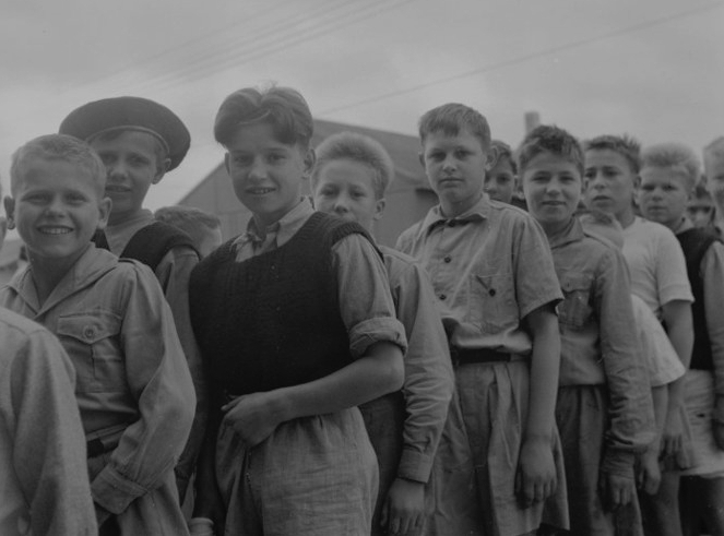 Tadeusz is at the 
back of a line of boys, outside, in Pahiatua.